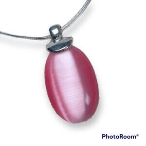 Pink cat's eye pendant on multi-strand necklace